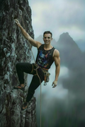 Maybe a relaxed muscular man on a mountain top about to climb a mountain maybe Where I at circle at connect those two
